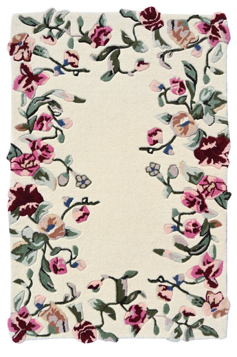 Floral patterned rug with pink, red, and green flowers on a beige background